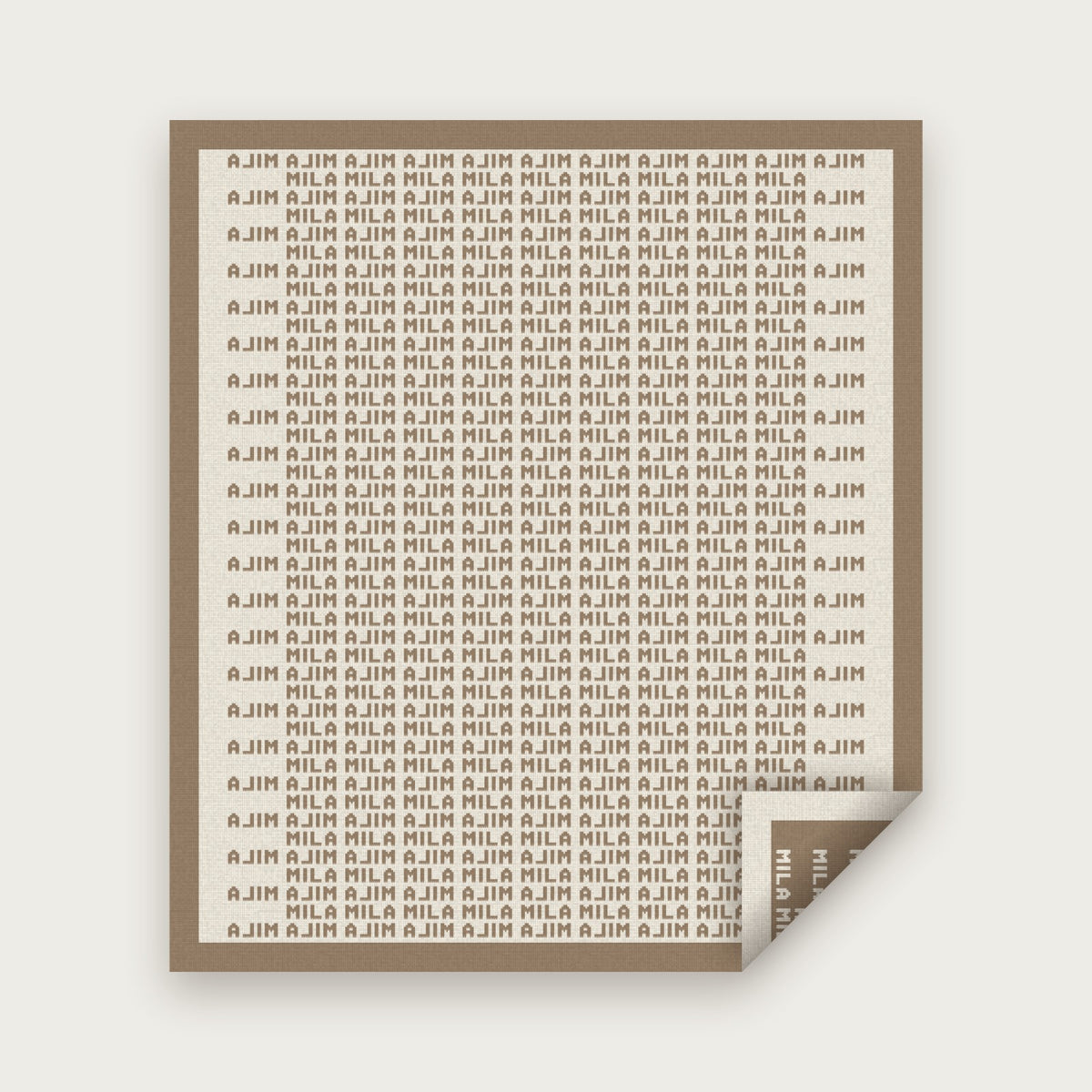 The Heir blanket in Taupe and bone, laid flat with one corner folded back to show the reverse